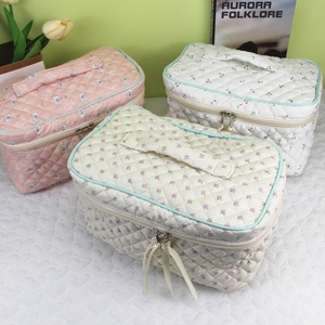 Three-piece quilted cotton makeup bag set with cherry floral prints and metal dual zippers