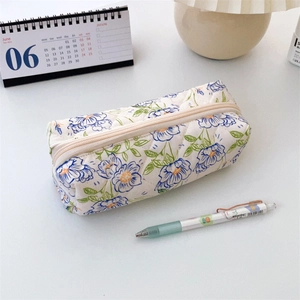 Macro detail of the quilted floral pencil case with secure zipper and vivid flower print