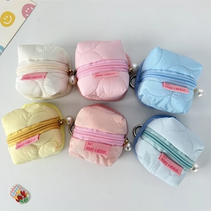 Mini quilted floral pouches in multiple colors with pearl charms and metal hooks