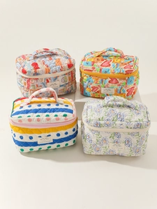 Quilted cotton makeup bags showing floral patterns, heart prints, and sturdy top handles