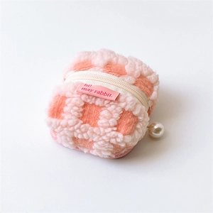 Pink waffle plush earphone case with white zipper and decorative pearl pendant