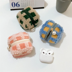 Checkered plush earphone cases with pearl zippers shown with a wireless charging case