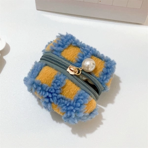 Close-up of blue and yellow waffle plaid plush earphone case with a large pearl pendant