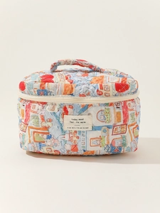 Detailed view of quilted cotton makeup bag featuring whimsical cartoon house illustrations