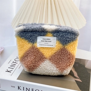 Colorful plush canvas organizer bag with checkered pattern and metal ring zipper detail
