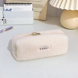 Close-up of soft plush pencil case with zipper puller and mayrabbit brand logo
