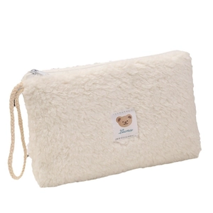 Plush cream makeup bag with cute bear label and wrist strap for portable travel storage