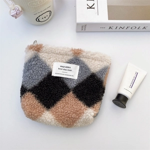 Detailed view of plush quilted storage bag with Kinfolk magazine and coffee items