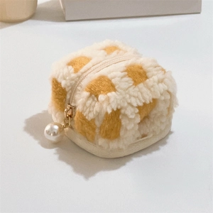 Close-up of yellow checkered fleece earphone pouch with an elegant pearl zipper pull