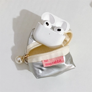 Silver metallic mini pouch with pearl zipper detail showing TWS earphone storage