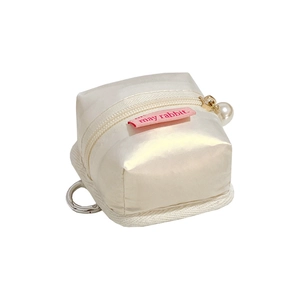 Mini tent-shaped cream earphone pouch with golden zipper and elegant pearl pendant