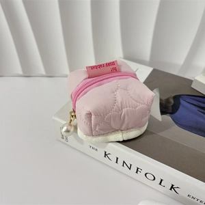 Pink heart quilted storage bag with zipper and decorative white pearl charm detail