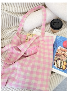 Pink and white checkered canvas tote bag with a 3D bow detail on soft knit fabric