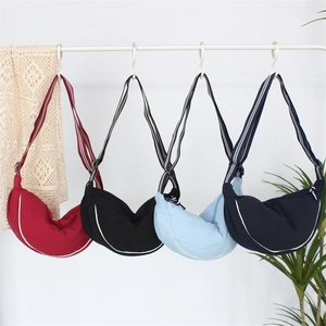 Adjustable pet sling carrier in four colors with wide striped straps and moon shape