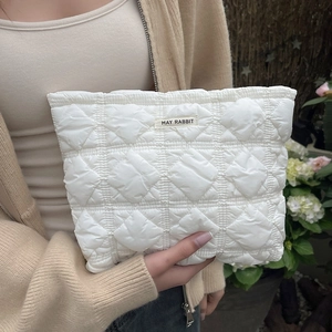Quilted white cosmetic bag with elegant checkered pattern and MAY RABBIT woven label