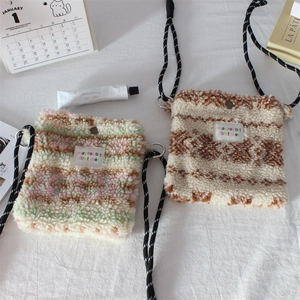 Striped plush crossbody bags with thick rope straps in pastel and neutral colors