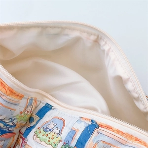 Macro detail of quilted makeup bag with zipper closure and cute rabbit pattern