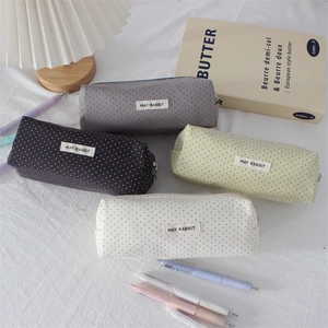 Detailed set of four canvas polka dot pencil cases in gray, navy, green and beige