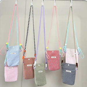 Checkered canvas mini crossbody phone bags with adjustable straps in various colors