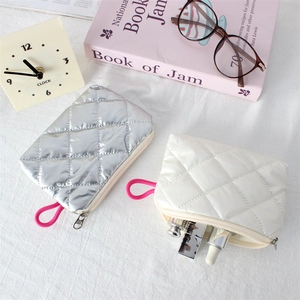 Quilted rhombus coin purse with pink woven strap in silver and white PU leather colors