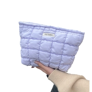 Quilted purple makeup bag with diamond stitching and zipper closure by May Rabbit