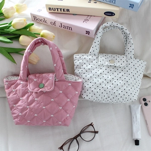 Quilted heart and polka dot cotton tote bags displayed with lifestyle accessories