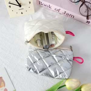 Quilted mini organizer bags in off-white and silver for cosmetics and daily essentials