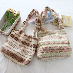 Flat lay of ethnic plush tote bags with vintage patterns and sherpa texture detail