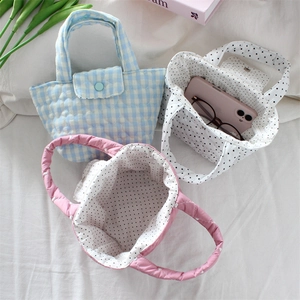 Three quilted mini tote bags with polka dots and gingham patterns in a soft cotton design