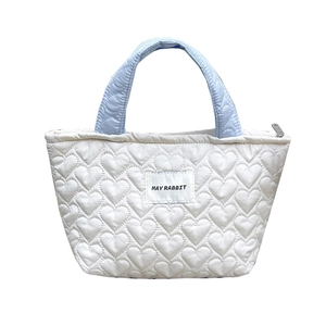 Quilted heart pattern handbag in white with light blue handles for daily use