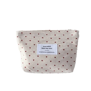 Canvas polka dot heart makeup bag with top zipper and mayrabbit label in cream white