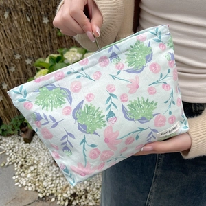 Floral makeup bag detail with pastel flower patterns and MAY RABBIT brand label