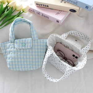 Quilted polka dot and plaid handbags featuring heart patterns and snap closure