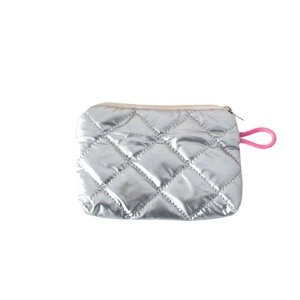 Metallic silver quilted mini coin purse with a vibrant pink knot zipper pull