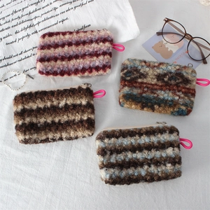 Fleece storage pouch set with vintage geometric patterns and pink lanyards for travel