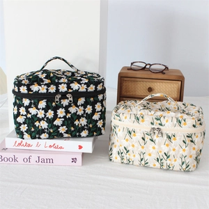 Daisy embroidered cosmetic bags with double zippers in black and cream canvas