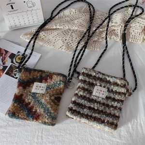 Detail of plush crossbody bags showing bohemian patterns and woven shoulder straps