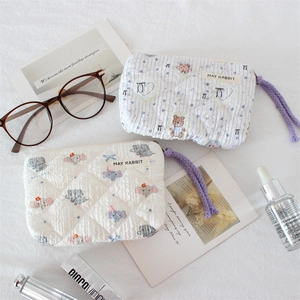 Quilted cotton cosmetic bags with cute animal prints and purple rope zipper pulls