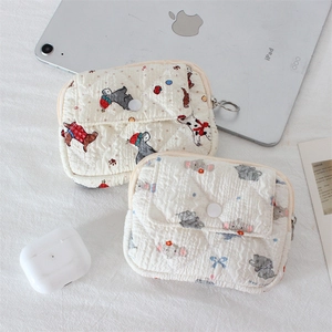 Quilted cotton mini pouch with elephant print next to AirPods for size reference