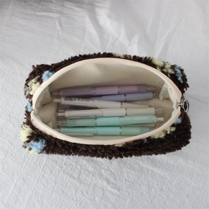 Top view of plush floral pencil pouch with large capacity storage for various pens