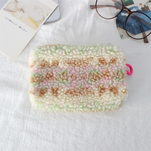 Detail of colorful plush sherpa storage bag with zipper and soft lamb wool texture
