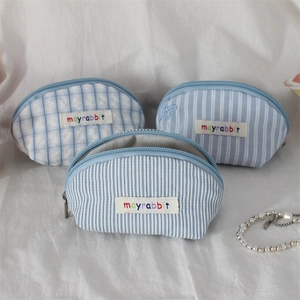 Mini light blue shell-shaped makeup pouch set with embroidery and zipper closure