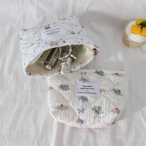Quilted cotton makeup bag with cute cartoon bear and elephant patterns in creamy tones