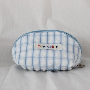Close-up of blue gingham mini shell pouch with embroidered logo and zip closure