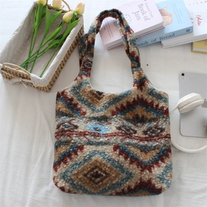 Detail of plush tote bag with ethnic geometric patterns, spacious interior shown with essentials