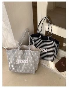 Detailed view of striped and star print canvas tote bags with embroidered baseball cap
