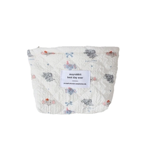 Quilted white cotton pouch featuring cute grey elephant prints and top zipper closure
