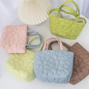 Five colorful quilted floral tote bags in pink yellow green blue and brown colors