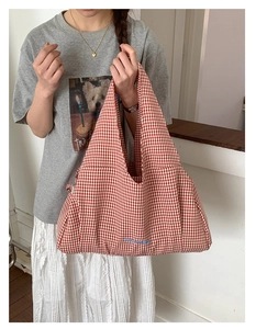 Detail of red gingham tote bag with Goodthing blue embroidery and spacious interior