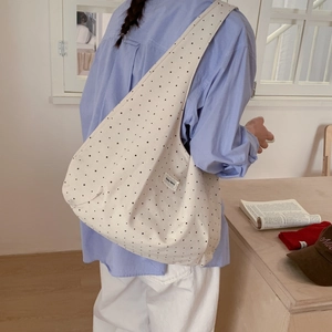 Minimalist cream canvas tote bag with black star pattern for daily student commute